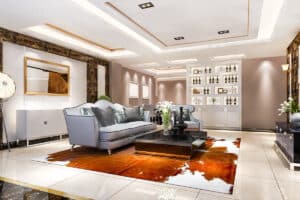 Salon moderne de luxe avec mobilier élégant et étagères décoratives, reflétant les tendances du marché immobilier de luxe.